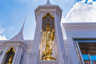 Low angle view of statue against building