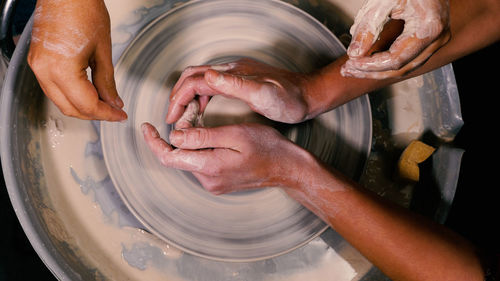 Cropped image of man making pottery