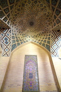 Low angle view of ornate ceiling of building