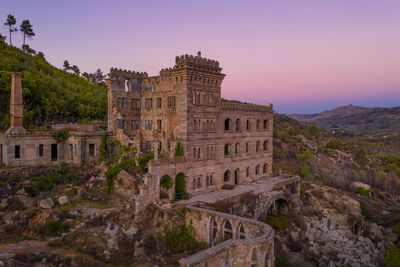 Drone aerial panorama of termas radium hotel serra da pena at sunset in sortelha, portugal