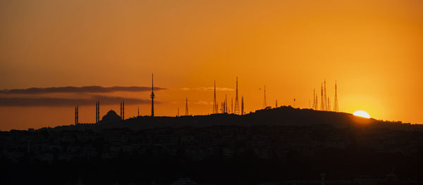Sunrise and mosque and city silhouette in istanbul