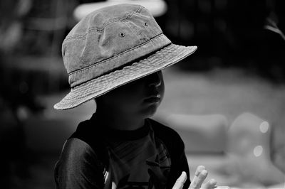 Close-up of boy wearing sun hat during sunny day