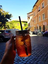 Close-up of hand holding drink