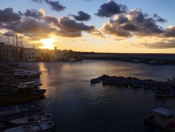 View of harbor at sunset