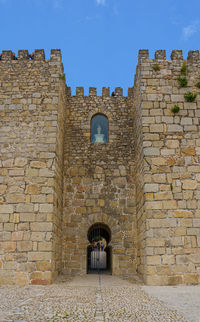 Built structure against brick wall