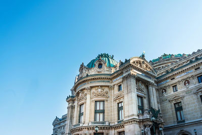 Low angle view of building against blue sky