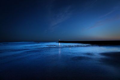 Scenic view of sea against clear blue sky