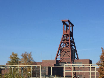 Low angle view of built structure against clear blue sky