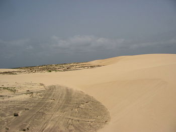 Scenic view of desert against sky