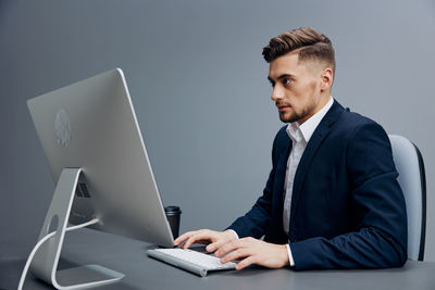 Businessman working on desktop pc