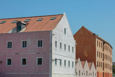 Low angle view of building against blue sky