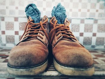 Close-up of brown shoes on steps