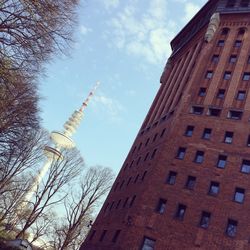 Low angle view of clock tower against sky