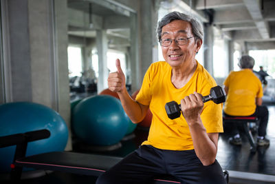 Portrait of smiling man sitting at home