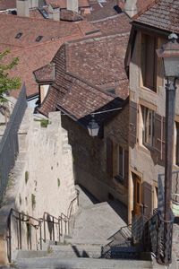 High angle view of houses by street in city