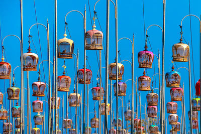 Bird cage hanging on pole against blue sky. contest bird sound tradition in thailand