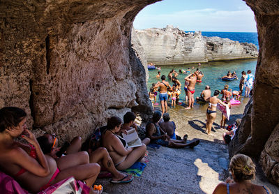 People relaxing on beach