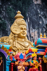 Statue of buddha against building