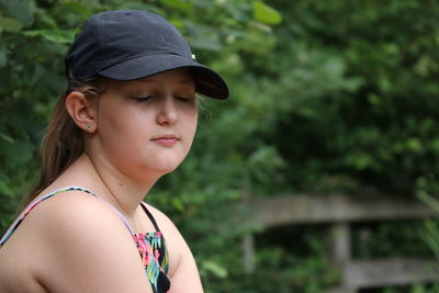 Portrait of a smiling young woman looking away