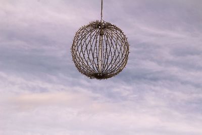 Low angle view of decoration hanging against sky