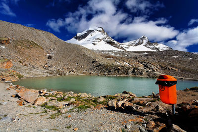 Recycle bin by river at gran paradiso national park