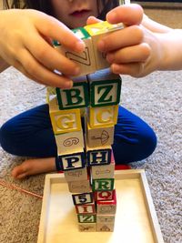 Close-up of baby playing with hands