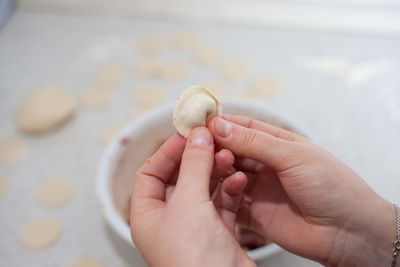 Close-up of hand holding ice cream