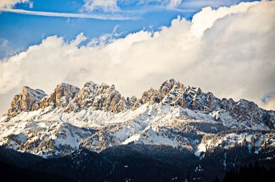 Scenic view of snow covered mountains against sky