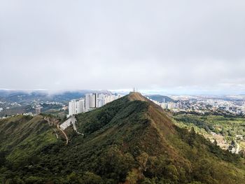 Panoramic view of buildings in city against sky