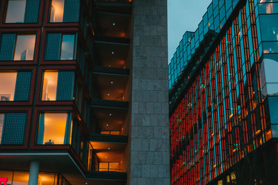 Low angle view of illuminated building at dusk