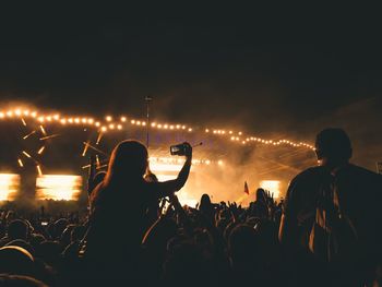 People enjoying music concert