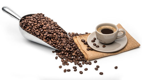 High angle view of coffee cup against white background