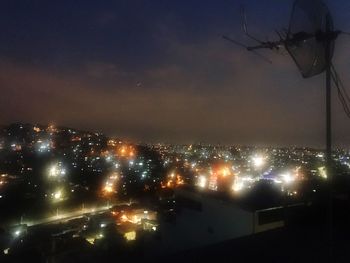 High angle view of illuminated buildings in city at night