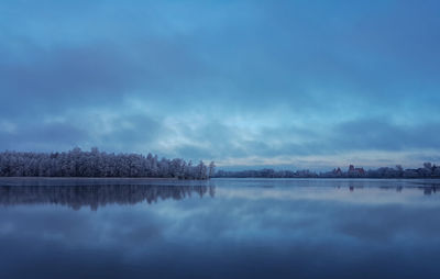 Scenic view of lake against sky during winter