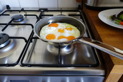 Fried egg in pan on stove