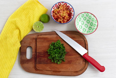 High angle view of chopped vegetables on cutting board