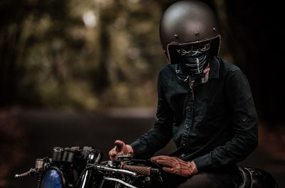 Man riding motorcycle at night