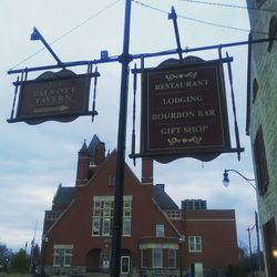 Low angle view of road sign against sky