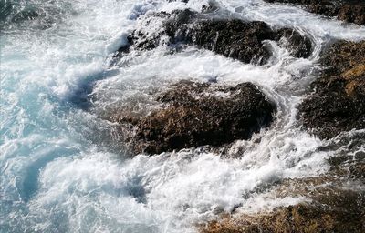 Sea waves splashing on rocks