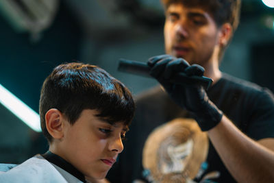 Portrait of hairdresser children haircut