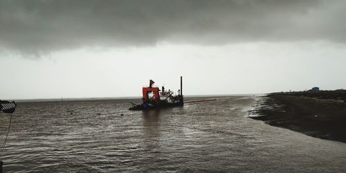 Nautical vessel on sea against sky