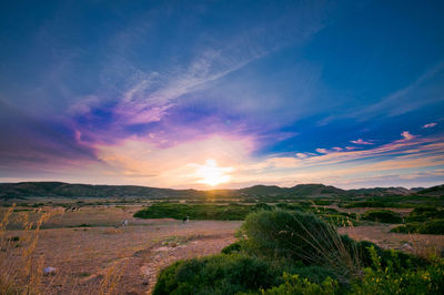 Scenic view of landscape against sky during sunset