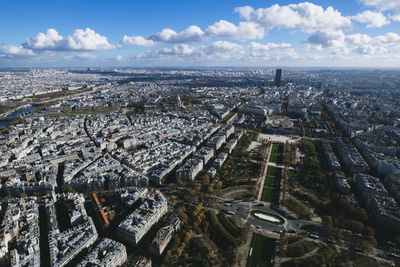 Aerial view of city and buildings against sky