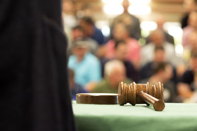 Close-up of gavel on table