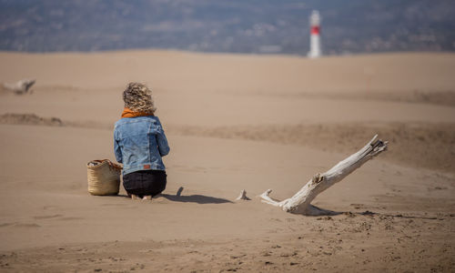 Rear view of woman on beach