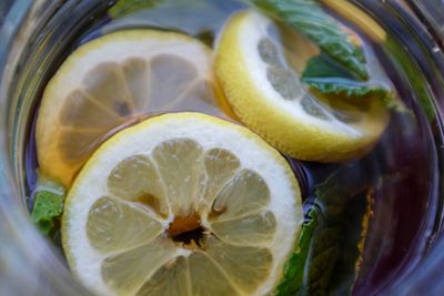 Close-up of lemon in glass