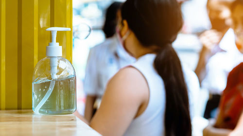 Side view of woman drinking glass