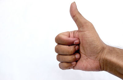 Close-up of human hand against white background