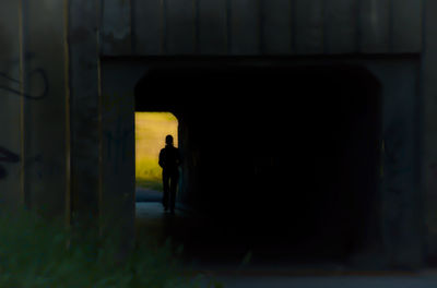 Silhouette man in corridor