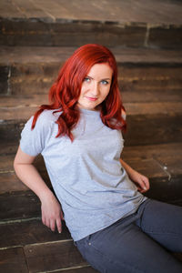 Portrait of beautiful woman sitting outdoors